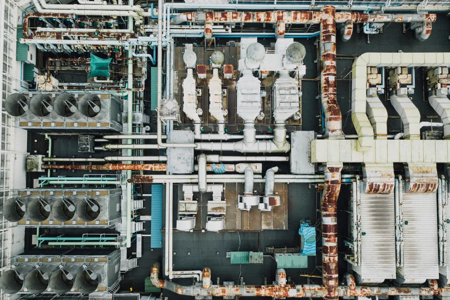 Industrial Services — engineer servicing heavy machinery